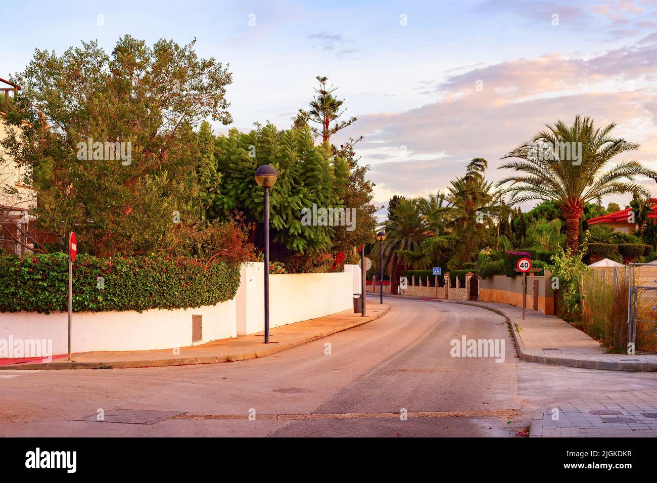 Evening street view in residential area with private houses, Alicante, Spain Stock Photo
