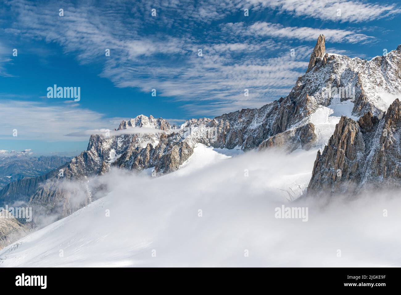The Geant glacier in the massif of Mont Blanc; in the background the peak of the Dent du Géant Stock Photo