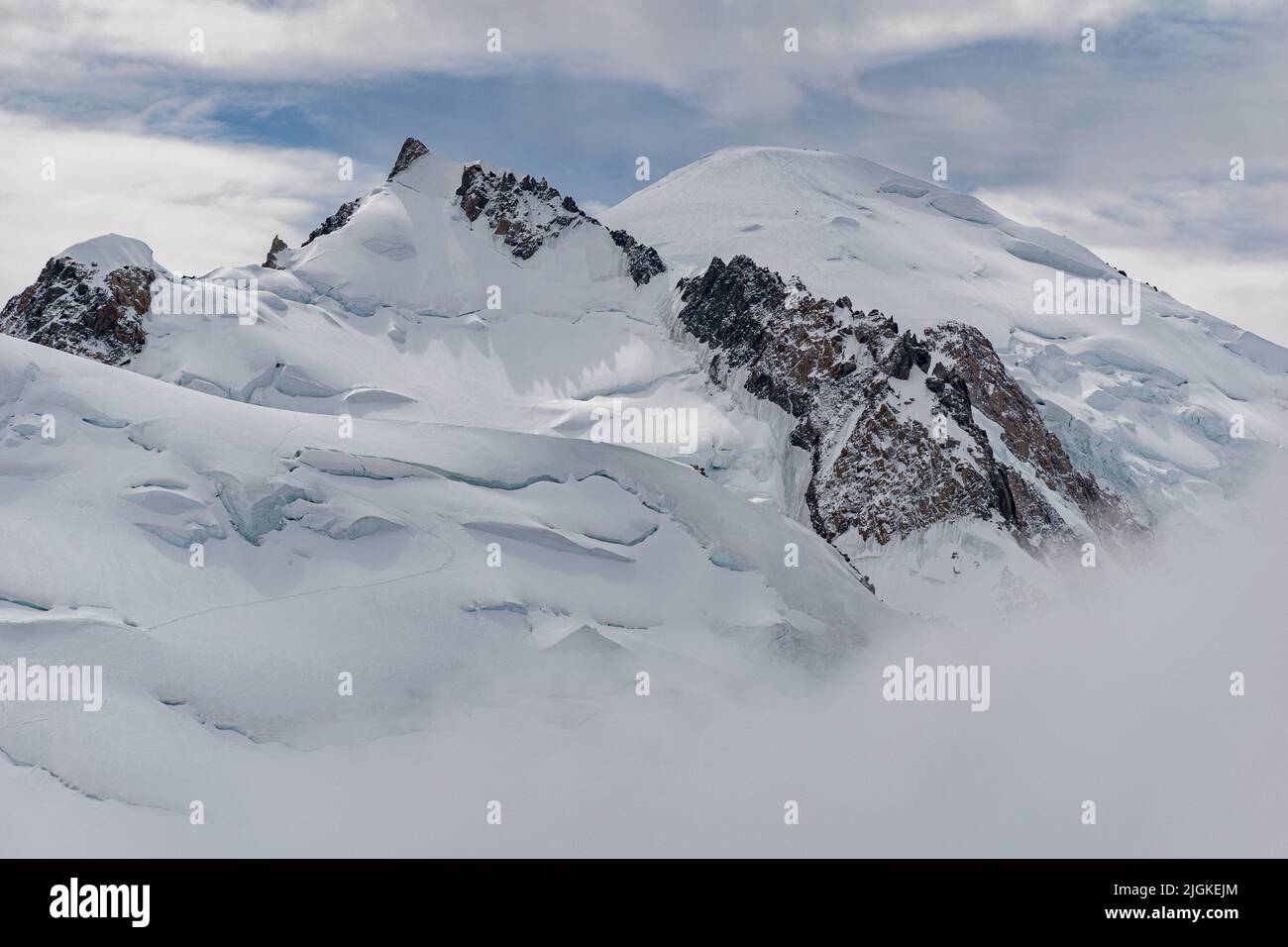 The summit of Mont Blanc, highest mountain range in the Alps, seen from the Aiguille du Midi Stock Photo
