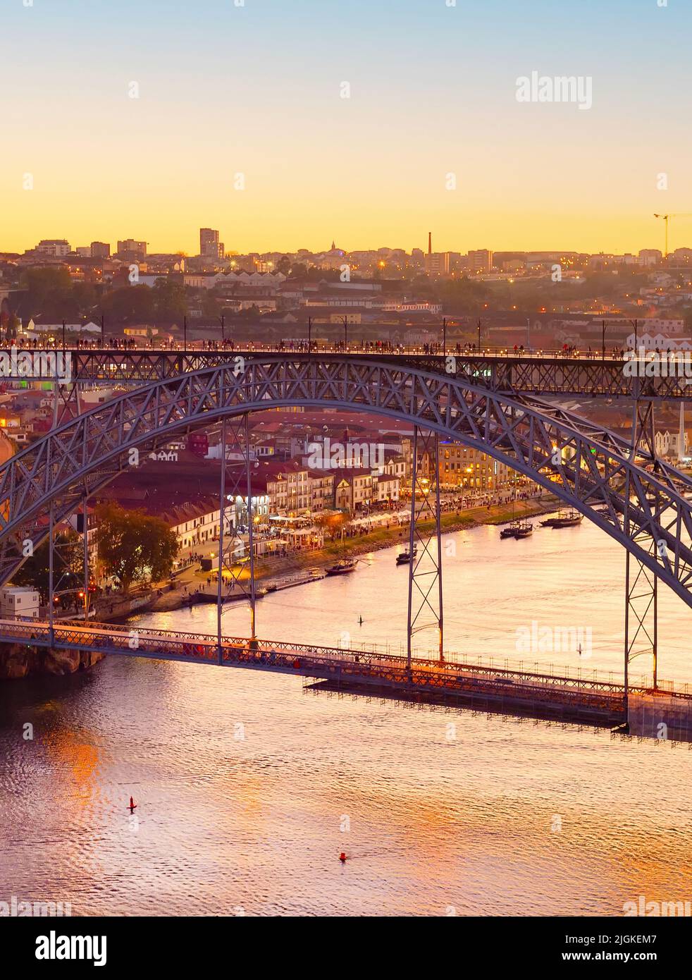 Golden hour, Porto cityscape in golden sunset light, Dom Louis bridge, Douro river, Portugal Stock Photo