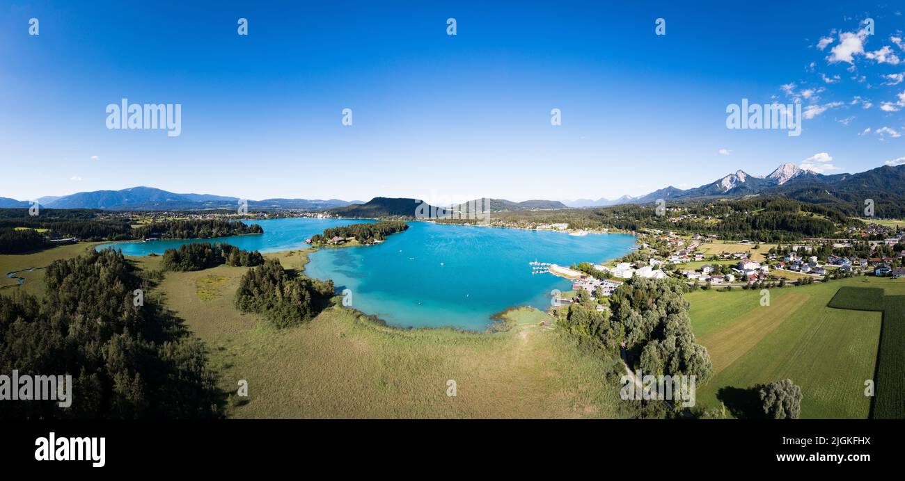 Faaker See panorama. Scenic aerial view to the famous lake in Carinthia, Austria during summer. Stock Photo