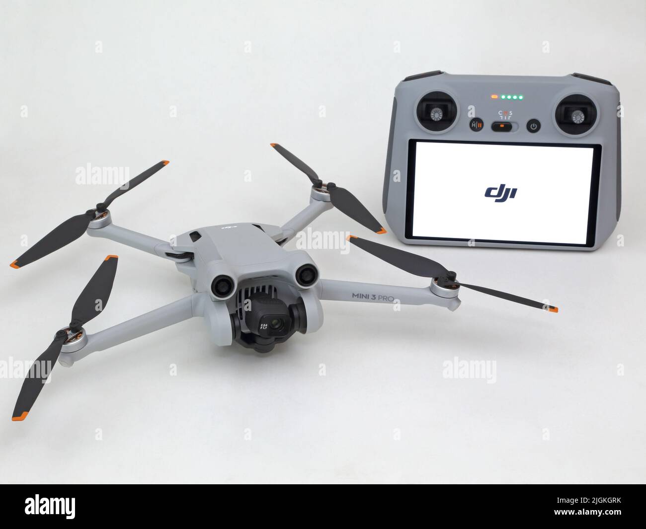 USA - July 8, 2022: A DJI Mini 3 Pro drone / UAV (unmanned aerial vehicle) and remote controller are shown up close, set against a white background. Stock Photo