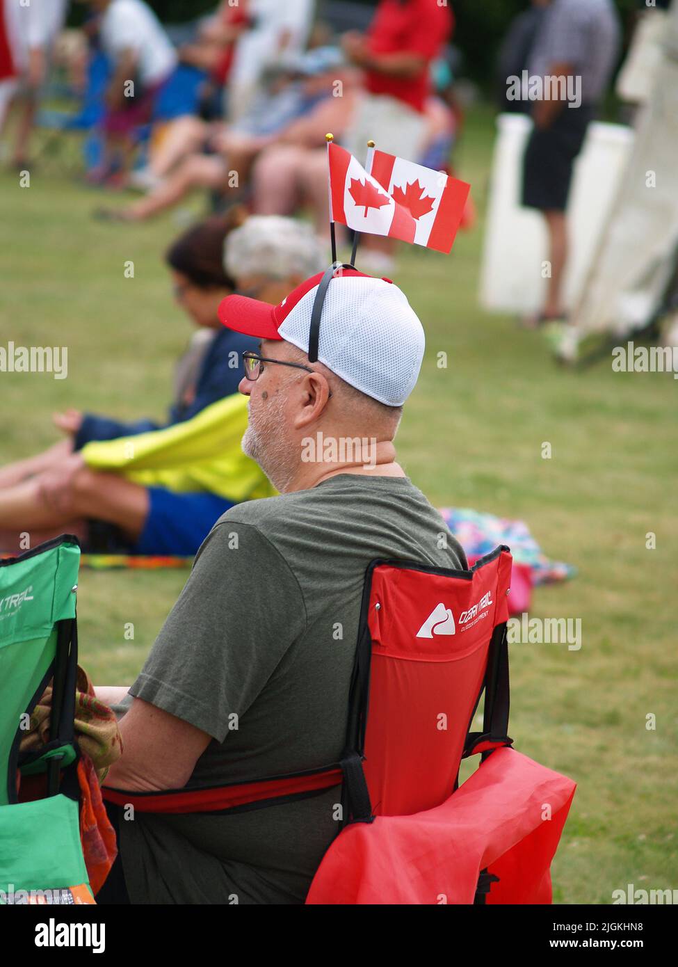 Man with Canadian flags in his hat Stock Photo - Alamy