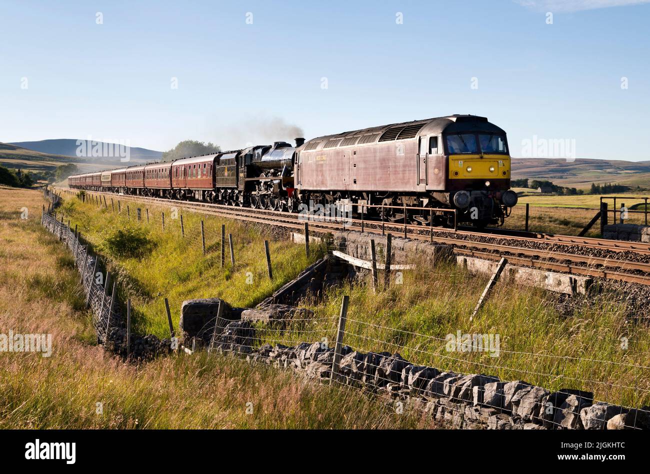 Steam loco 'Leander' is assisted by a diesel engine after technical problems on 'The Waverley' special run, from Hellifield to Carlisle and return. Stock Photo