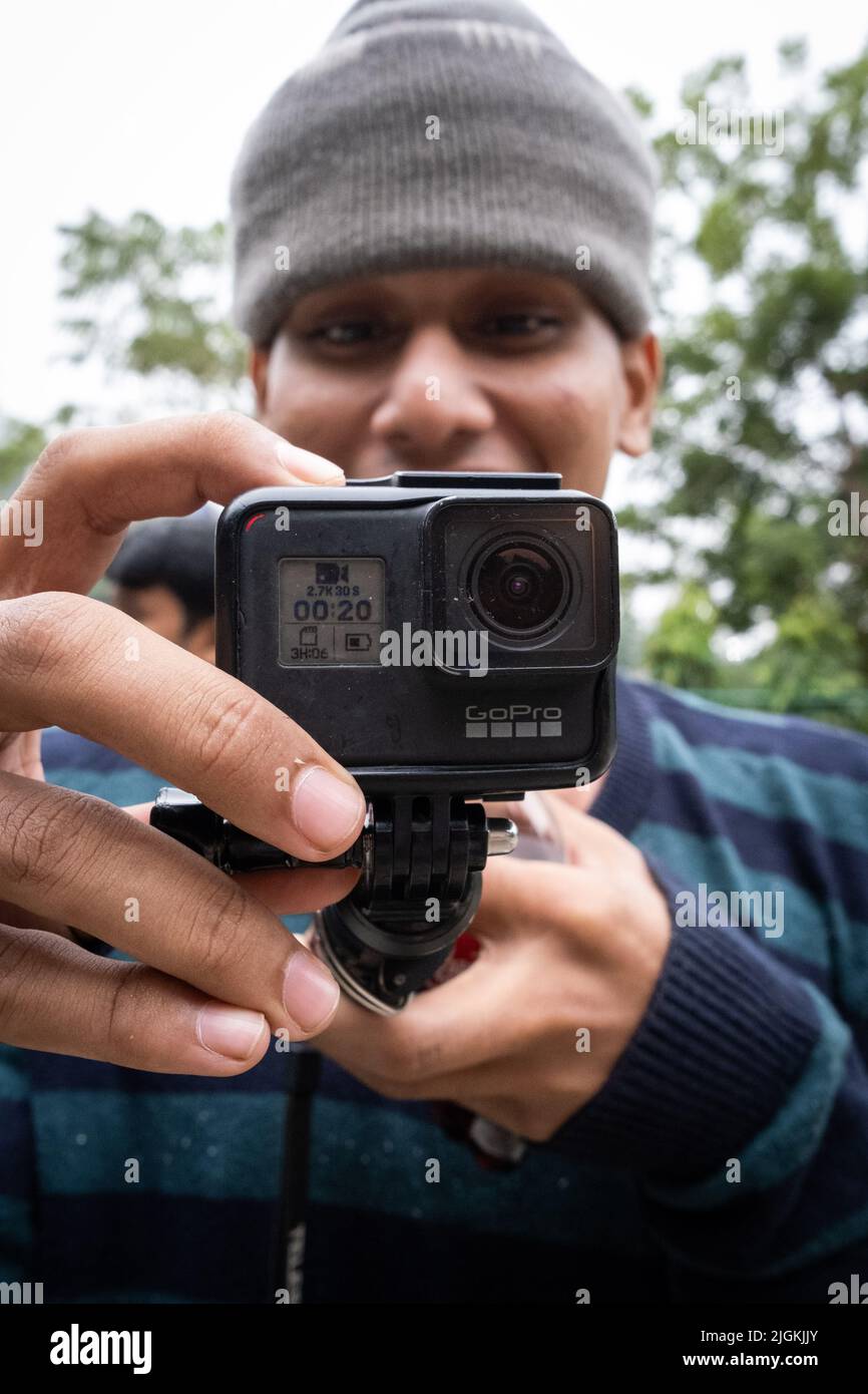 Pusle Using His Camera A bangladeshi male using his camera. Dhaka, Bangladesh Stock Photo - Alamy