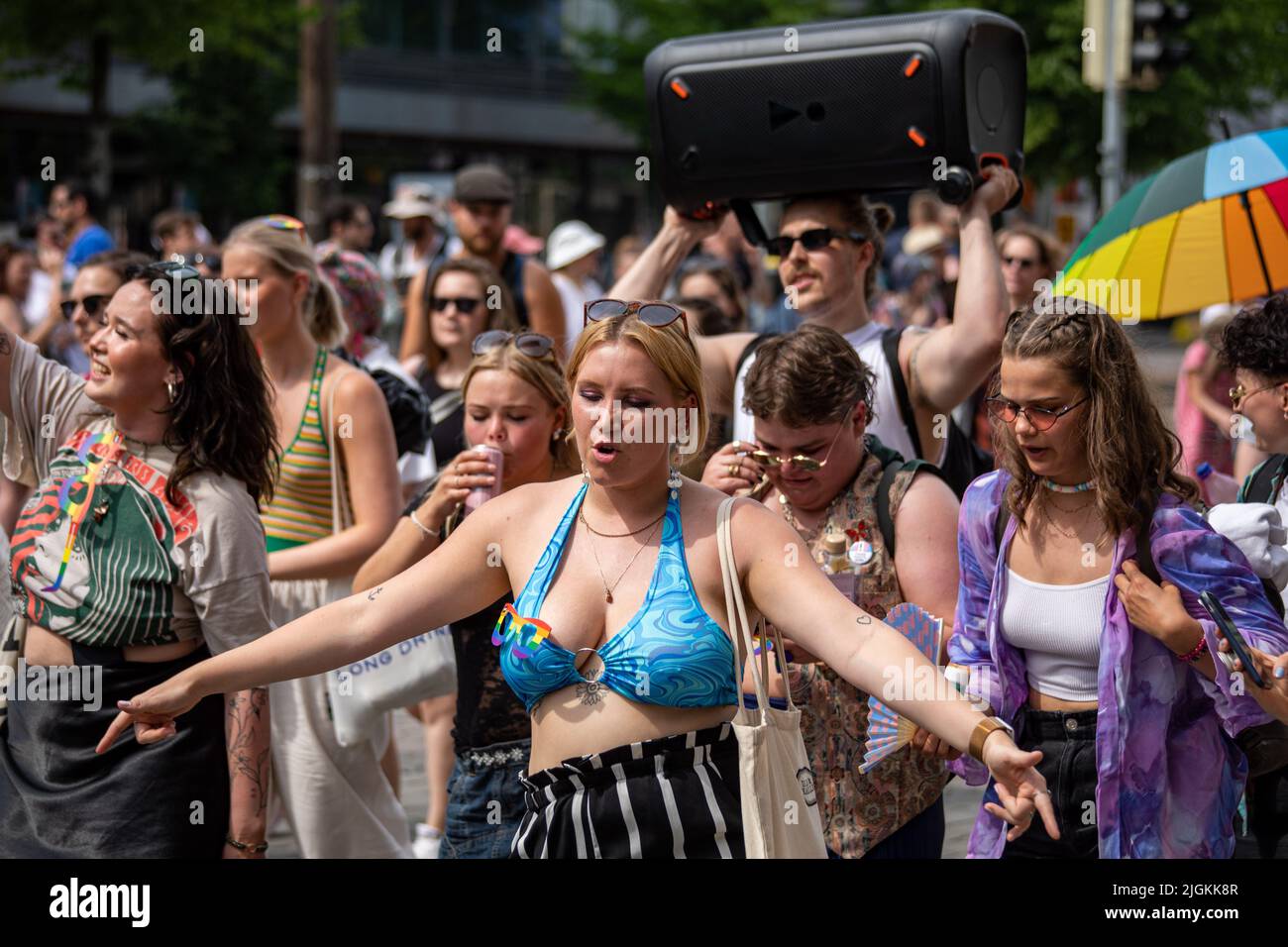 People dancing and celebrating at Helsinki Pride 2022 Parade in Mannerheimintie, Helsinki, Finland Stock Photo