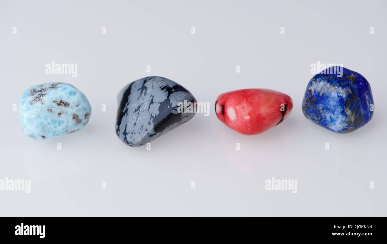 four different gemstones in a row against white background Stock Photo