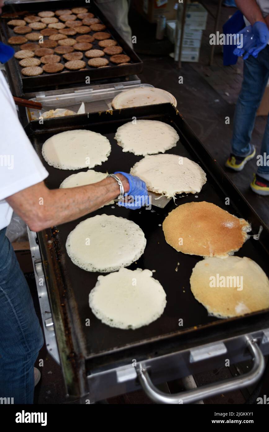 Volunteers cook pancakes at the annual 'Pancakes in the Park' Rotary Club fund-raising event in Santa Fe, New Mexico. Stock Photo