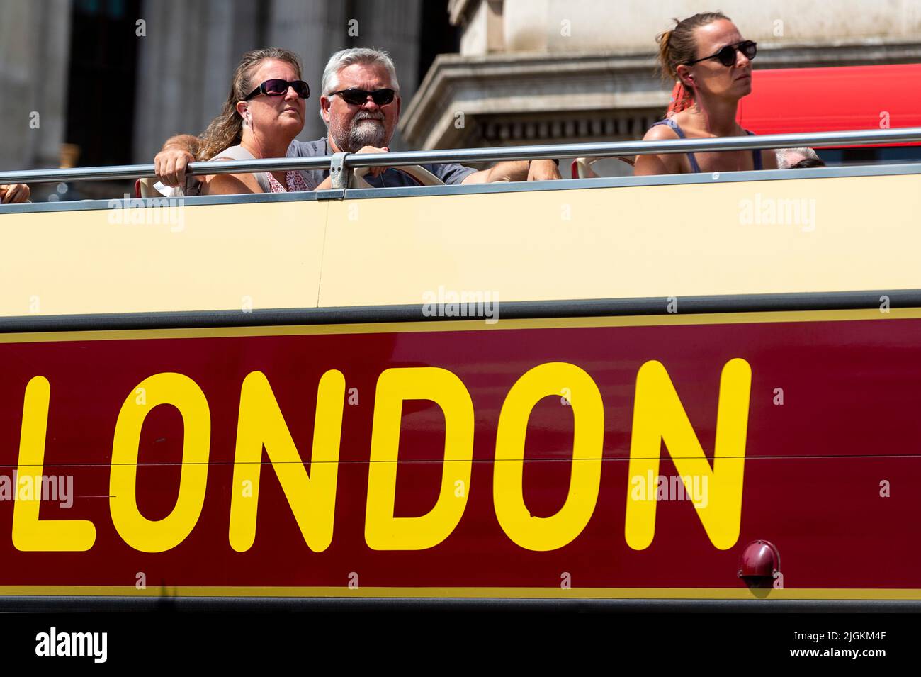 London, UK.  11 July 2022.  UK Weather – Tourists on an open top double-decker bus pass through Westminster when temperatures are expected to rise to 32C.  The UK is currently experiencing a heatwave and hot temperatures and a lack of rainfall is expected, particularly in the south east of the country, to continue for the next 10 days.  Credit: Stephen Chung / Alamy Live News Stock Photo