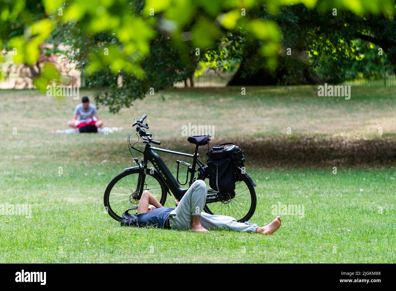 London, UK.  11 July 2022.  UK Weather – A man sunbathes in St James’s Park on a day when temperatures are expected to rise to 32C.  The UK is currently experiencing a heatwave and hot temperatures and a lack of rainfall is expected, particularly in the south east of the country, to continue for the next 10 days.  Credit: Stephen Chung / Alamy Live News Stock Photo
