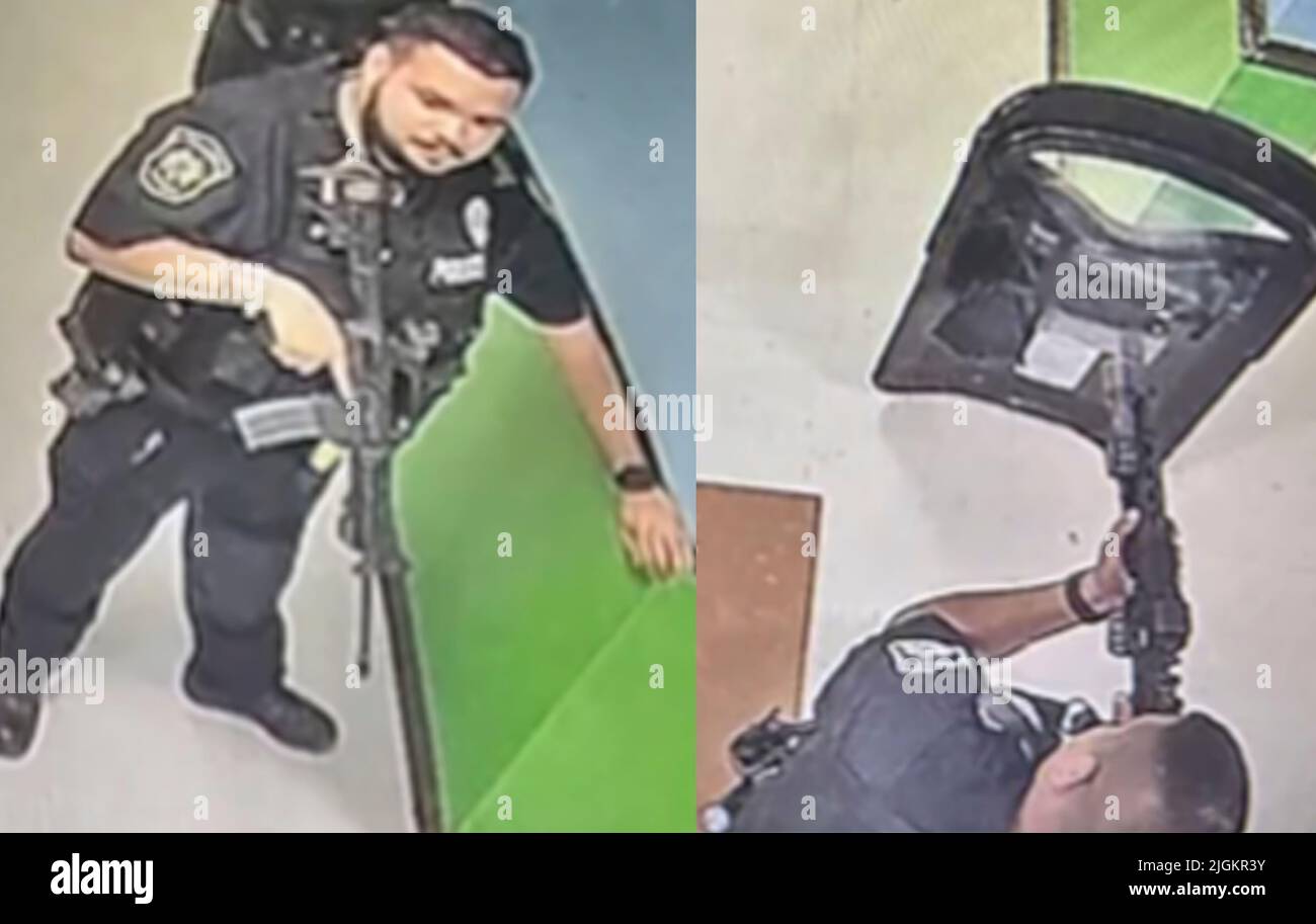 A  frame from a school surveillance video shows multiple police officers waiting in a hallway at Robb Elementary School armed with rifles and at least one protective ballistic shield. This was 19 minutes after receiving a 911 call from the school. The police waited nearly an hour and a half before entering the school room where the gunman was located. (Photo: Uvalde Investigative Files) Stock Photo
