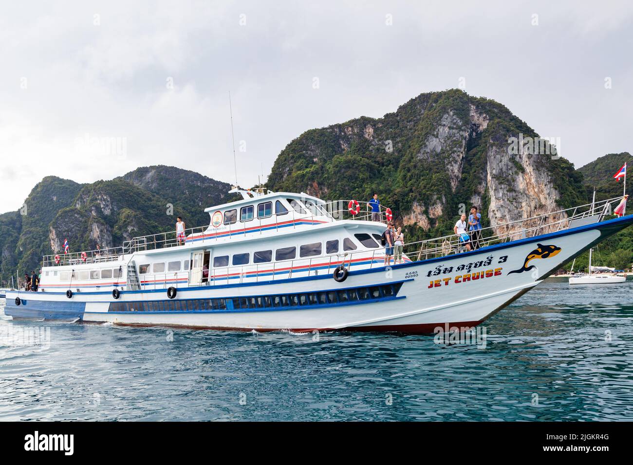 Phi Phi Islands, Thailand - December 18, 2010:  Tour boat off the coast of Phi Phi Island Stock Photo