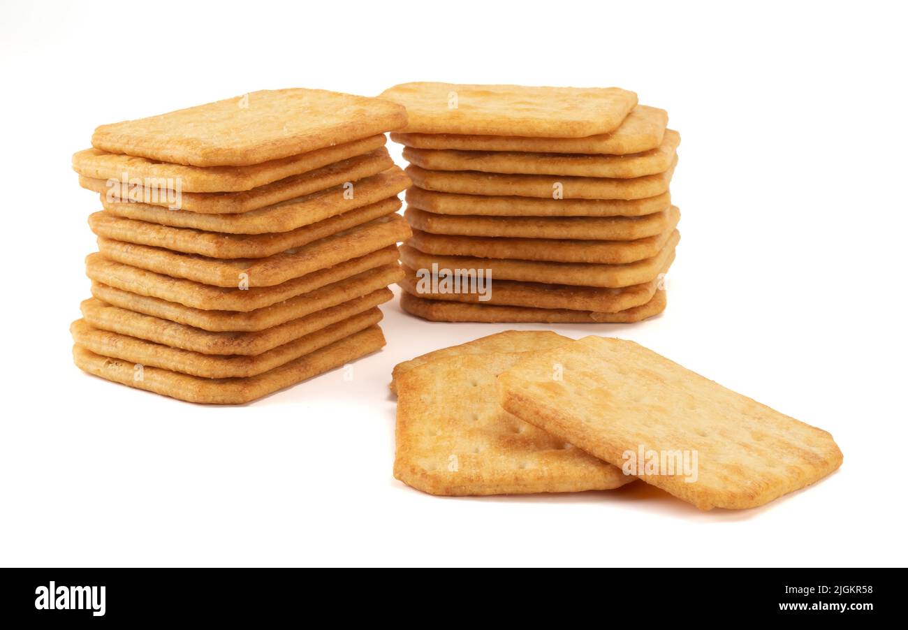 Salty square crackers isolated on bright background. Stock Photo