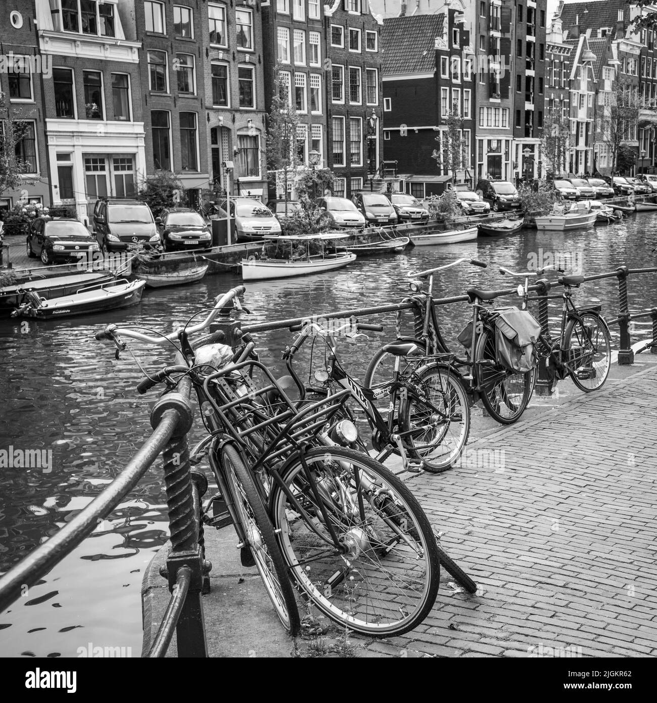 Amsterdam, Netherlands - September 9, 2011: Bicycles by canal railing in Amsterdam Stock Photo