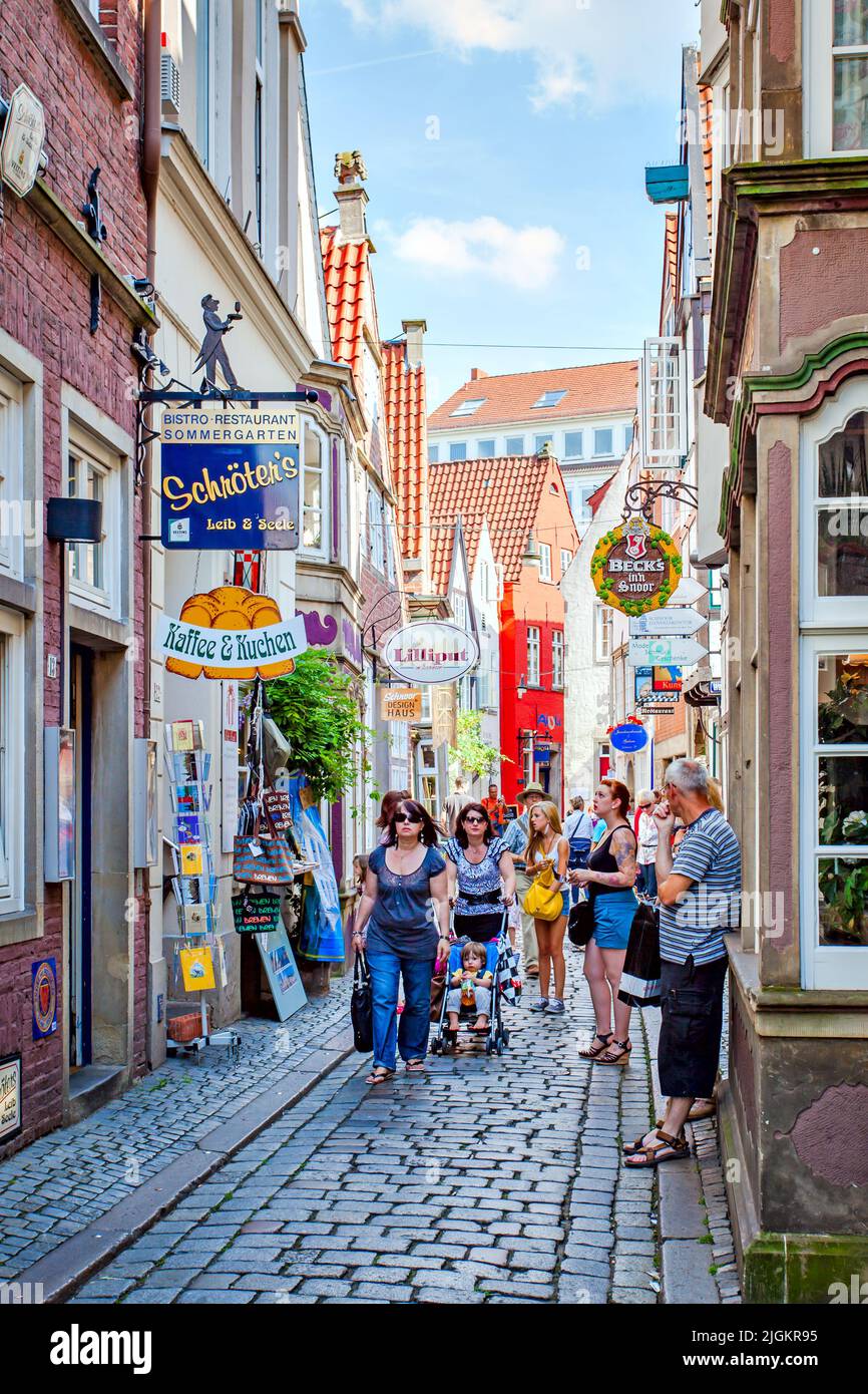 Bremen, Germany - August 17, 2012:  People in the old shopping stereet in Bremen Stock Photo