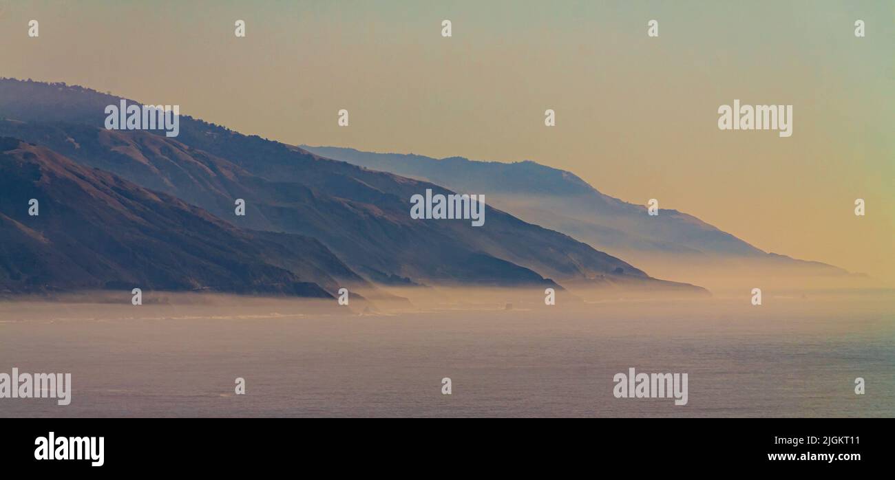 Fog Laden Sea Cliffs Of The Jagged Big Sur Coastline, Big Sur, California, USA Stock Photo