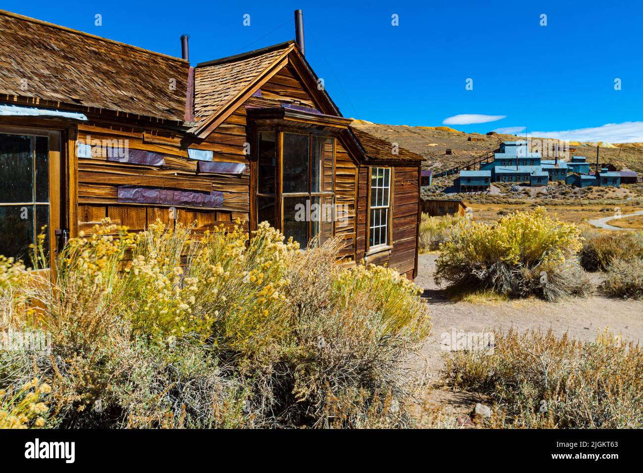 The Kirkwood House With The Standard Consolidated Mine in The Distance, Bodie State Historical Park, California, USA Stock Photo