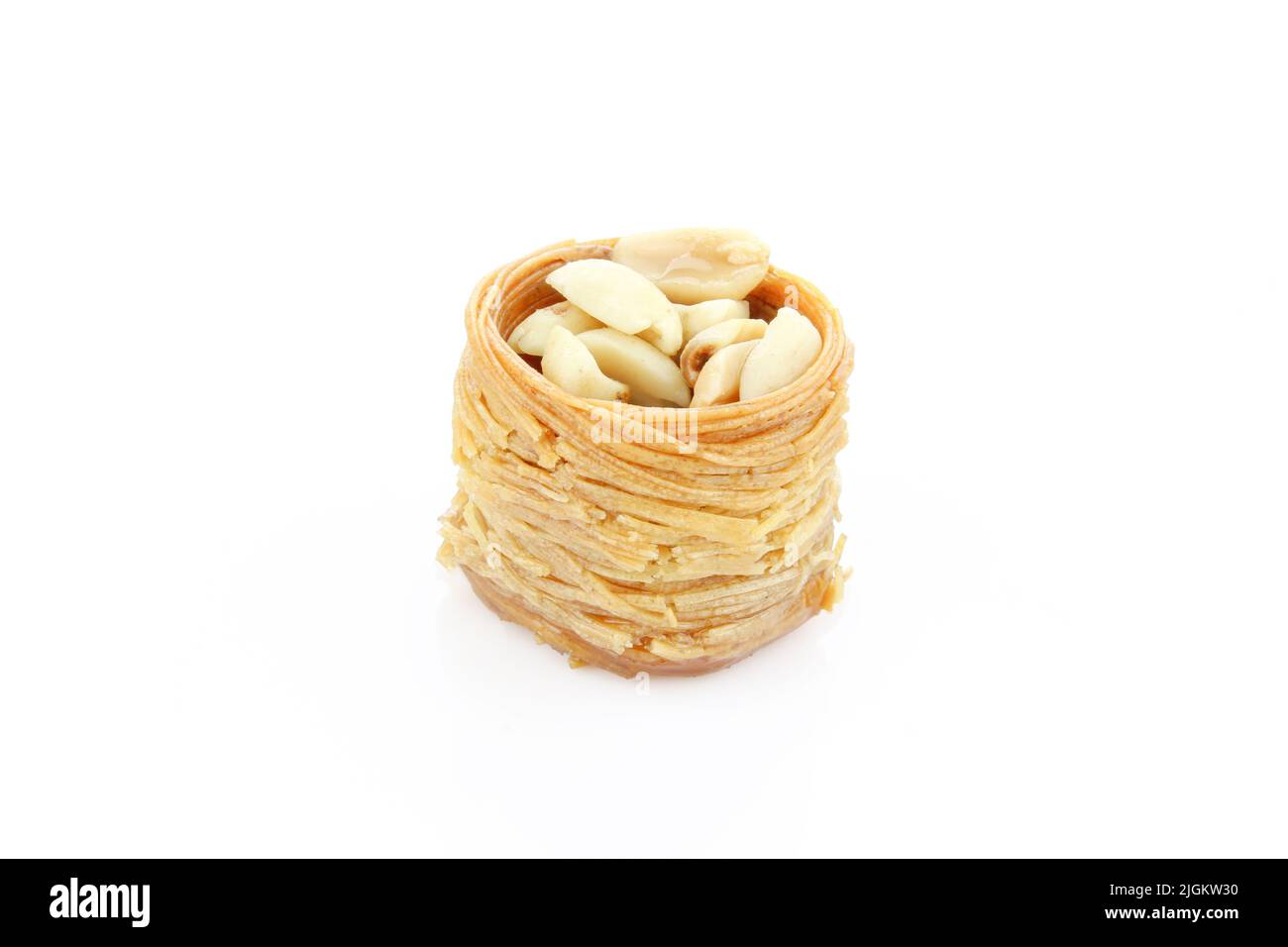 Peanuts in kadayif shaped like bird nest. Turkish delicacy isolated on
