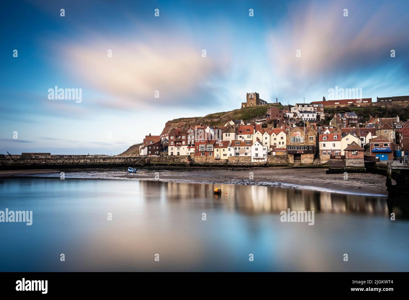 4 minute exposure at Whitby with St. Mary's Church on the hill Stock Photo
