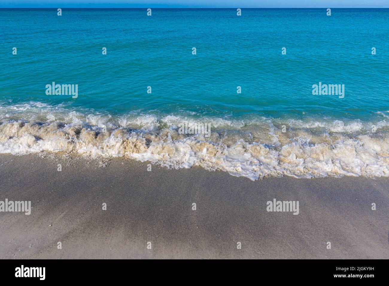 Waves Washing Over The White Sand of Coquina Beach, Bradenton, Florida, USA Stock Photo