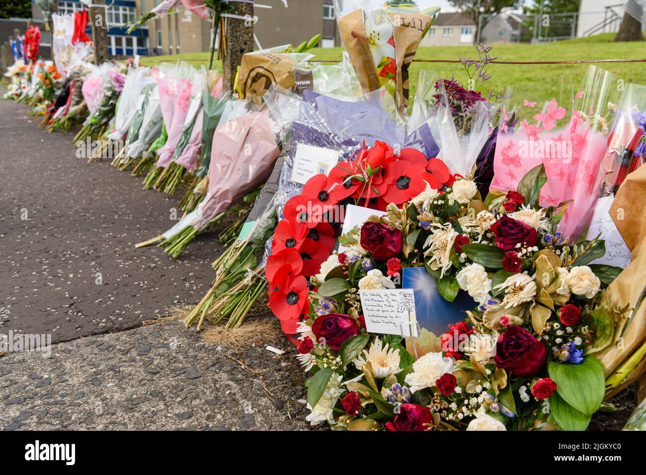 Larne, Northern Ireland, United Kingdom, UK. 11th July 2022 - Floral tributes are laid in memory of John Steele, who died after falling off a bonfire on Saturday evening. Credit: Stephen Barnes/Alamy Live News Stock Photo