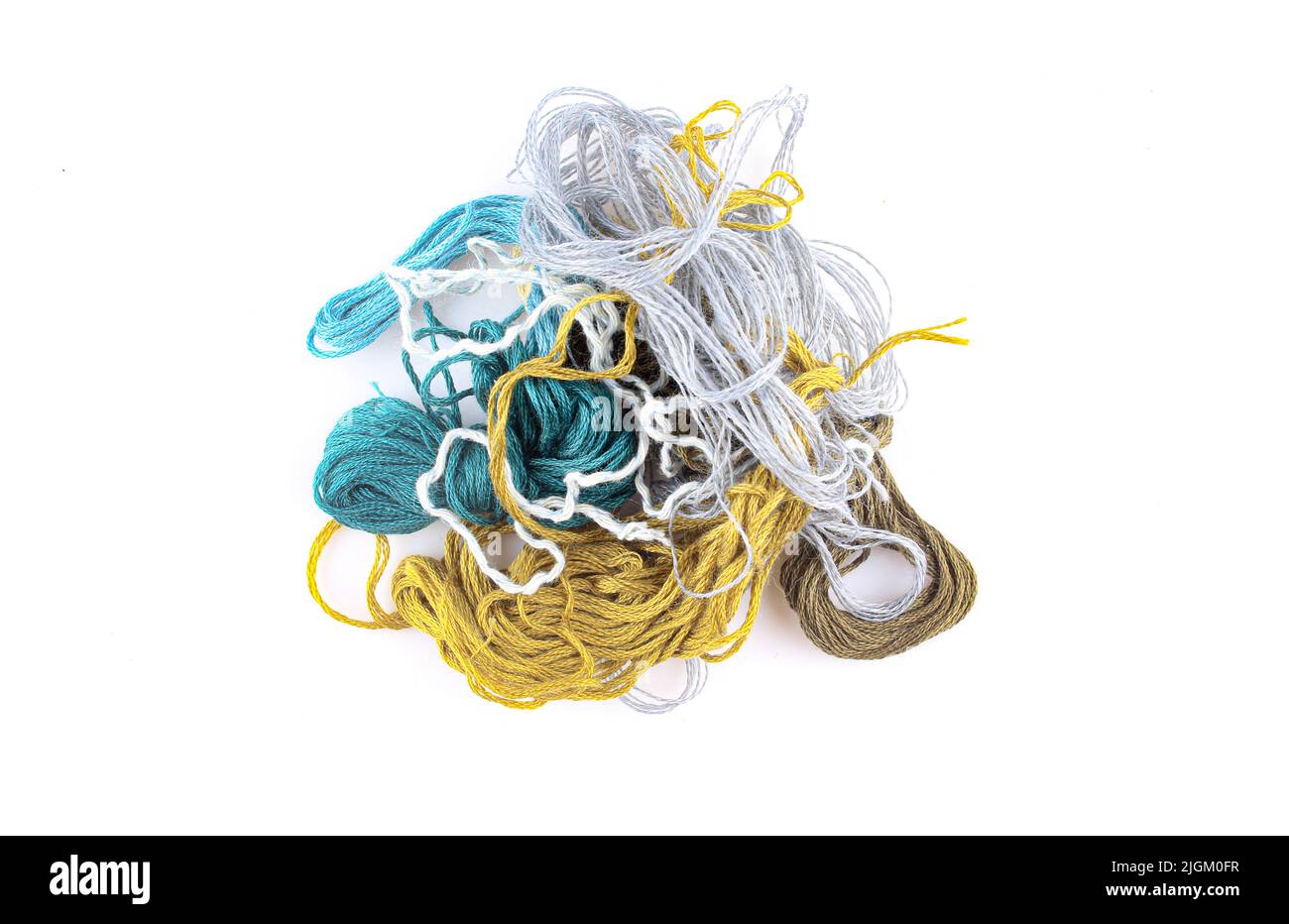 Bundle of tangled colorful textile strings isolated on white background Stock Photo