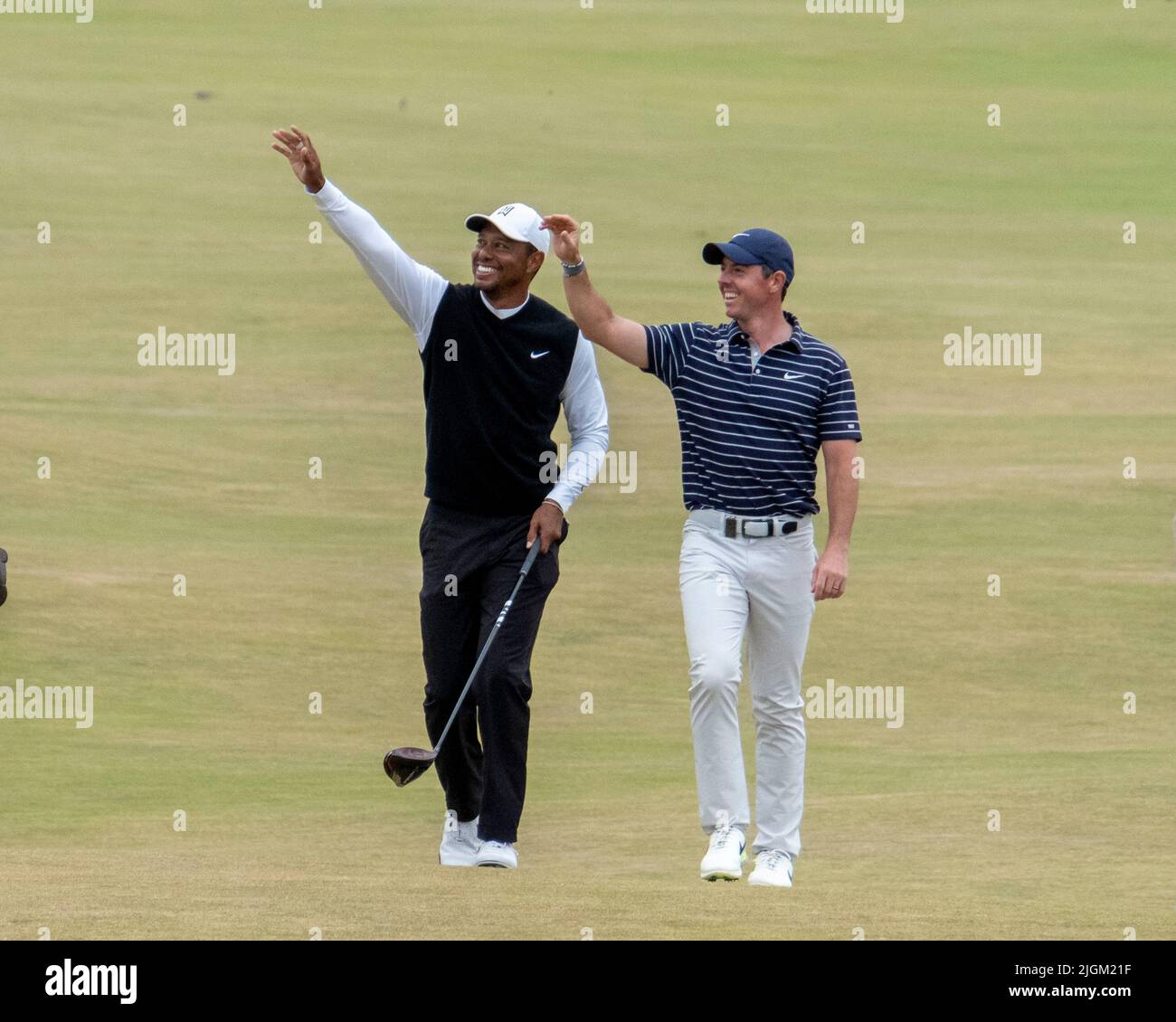150th Open Golf Championships, St Andrews, July 11th 2022  Tiger Woods (left) and Rory McIlroy wave to  the houses as they walk up the 18th fairway during the R&A's Celebration of Champions challenge at the Old Course, St Andrews, Scotland. Credit: Ian Rutherford/Alamy Live News. Stock Photo