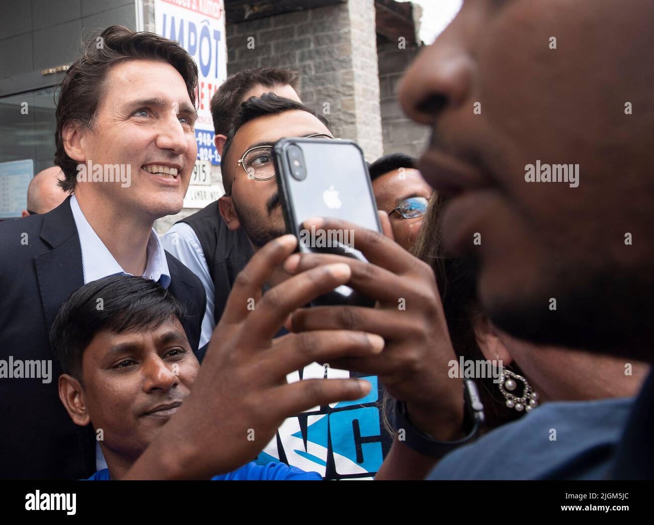 Prime Minister Justin Trudeau poses for a photograph during a visit to