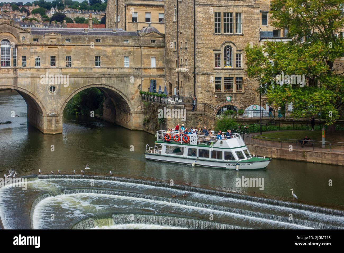 Pulteney Weir,River Avon,Bath. River Trip,Boat,Sir William Pulteney has just exited Pultney Bridge.  The weir is part of the flood protection scheme. Stock Photo