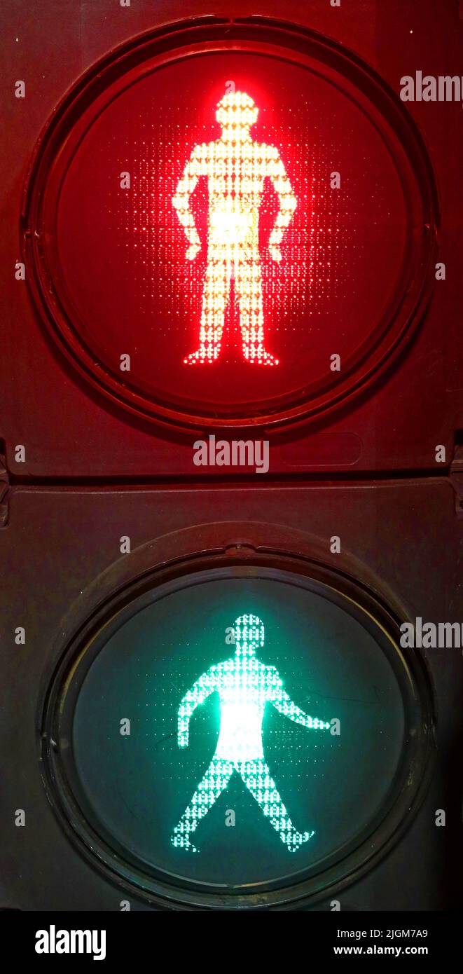 UK traffic signal for pedestrians - Red to stop, Green to go Stock Photo