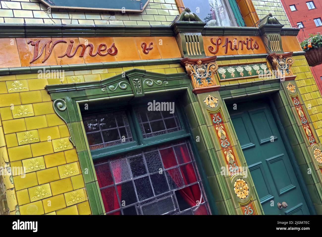 Wines and Spirits , Victorian tiles at The Peveril Of The Peak, pub at 127 Great Bridgewater St, Manchester, England, UK,  M1 5JQ Stock Photo