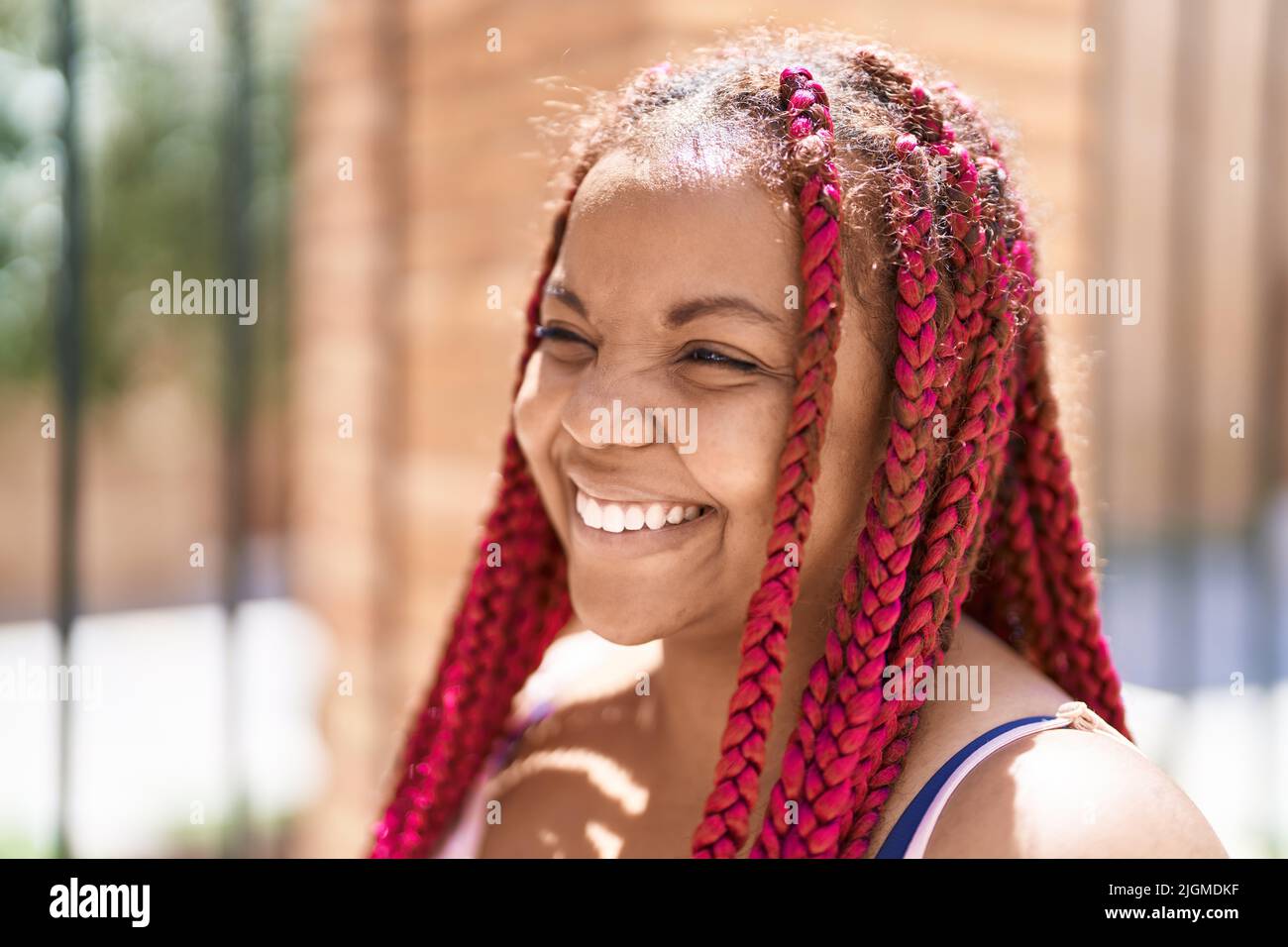 African american woman smiling confident looking to the side at street ...