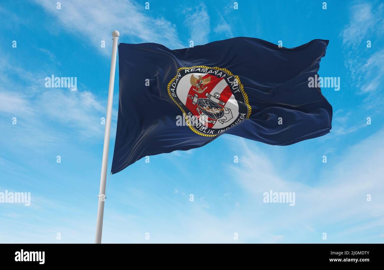 official flag of Maritime Security Agency Indonesia at cloudy sky