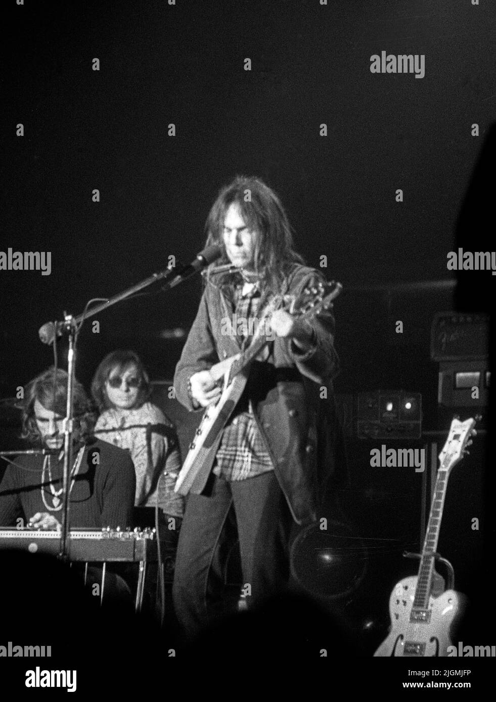 Neil Yong performing at the Fillmore West in San Francisco, CA, circa 1970s. Stock Photo