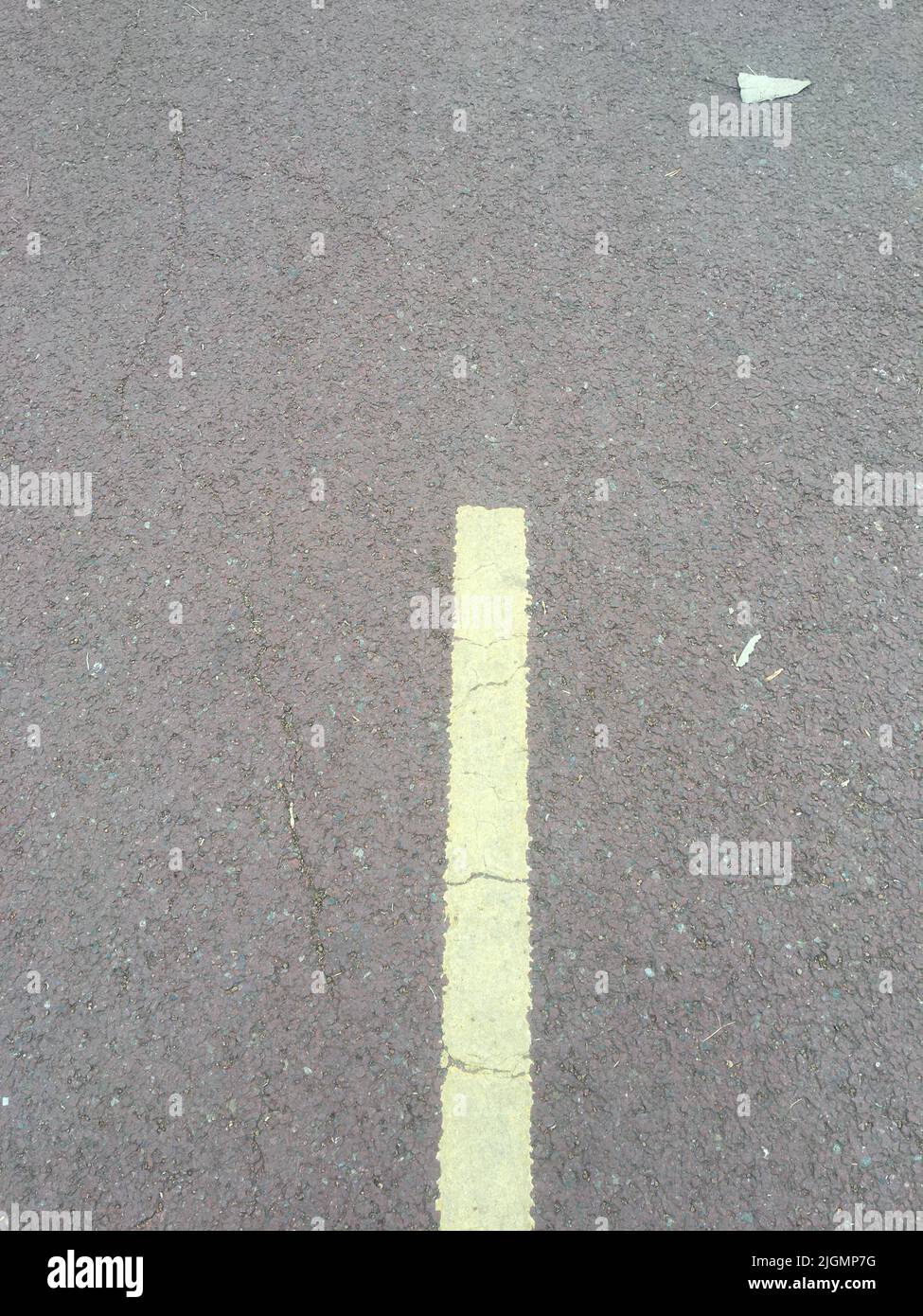 Gray asphalt road texture with dashed yellow line Stock Photo