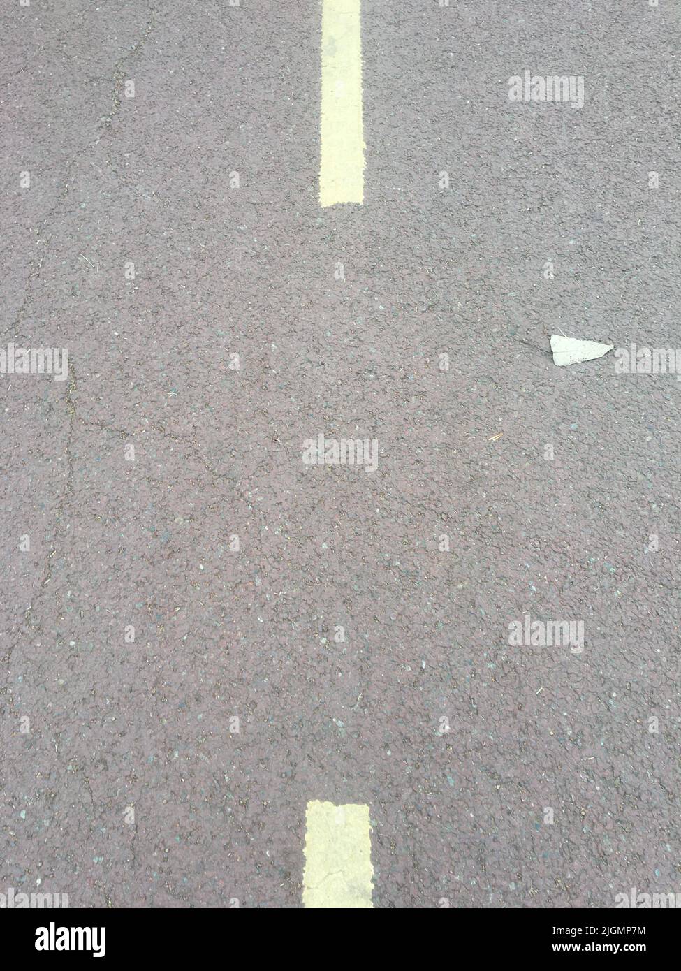 Gray asphalt road texture with dashed yellow line Stock Photo