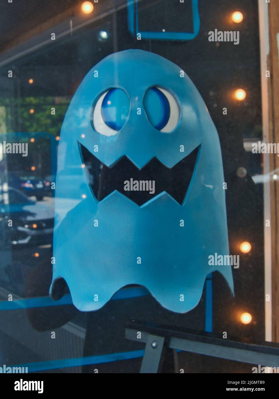 Pac Man Ghoul in Window Display at a Local Video Game Store Stock Photo