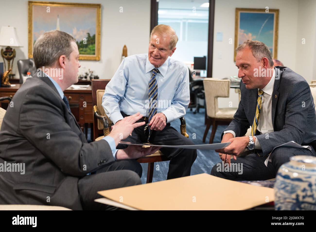 NASA Administrator Bill Nelson, center, and Associate Administrator for NASA's Science Mission Directorate, Thomas Zurbuchen, right, speak with Webb project scientist at the Space Telescope Science Institute, Klaus Pontoppidan, left, after being shown the first full-color images from NASA's James Webb Space Telescope in a preview meeting, Monday, July 11, 2022, at the Mary W. Jackson NASA Headquarters building in Washington. The first images and spectroscopic data from the world's largest and most powerful space telescope, set to be released July 11 and 12, will demonstrate Webb at its full po Stock Photo