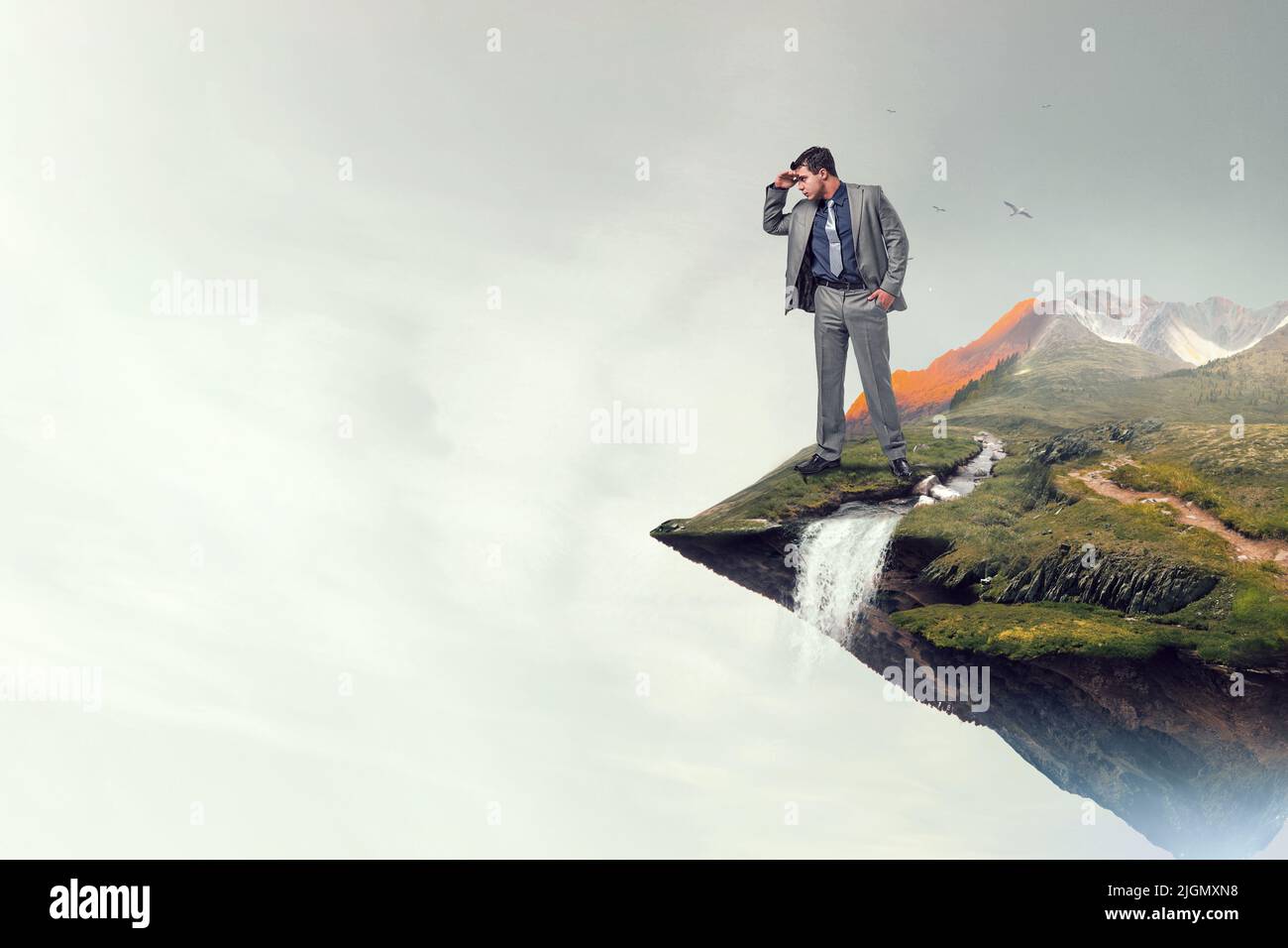 Businessman standing mountain top hi-res stock photography and images ...