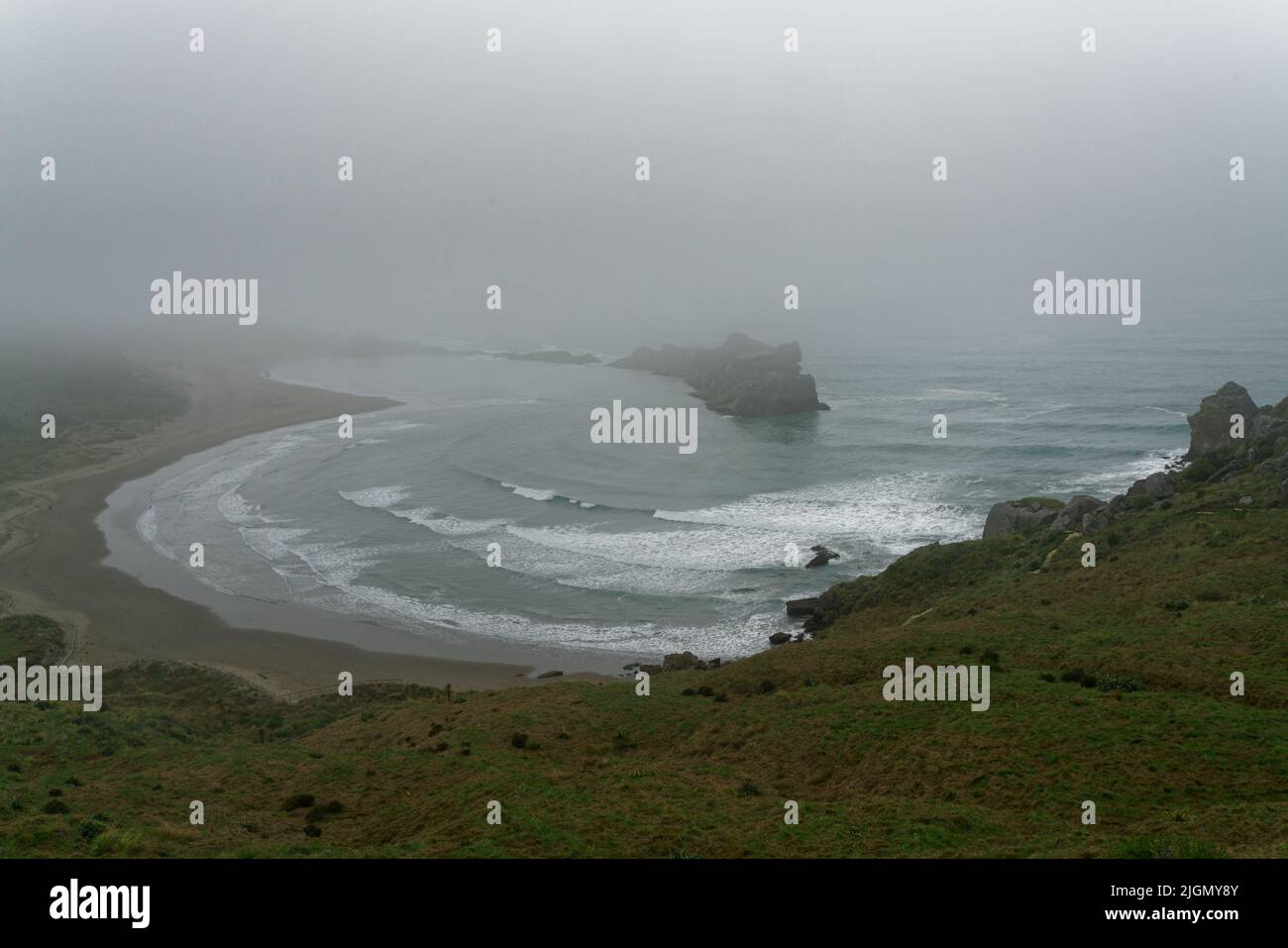 The Gap on a misty morning at Castle Point, near the lighthouse, Wairarapa, north island, Aotearoa /New Zealand. Stock Photo