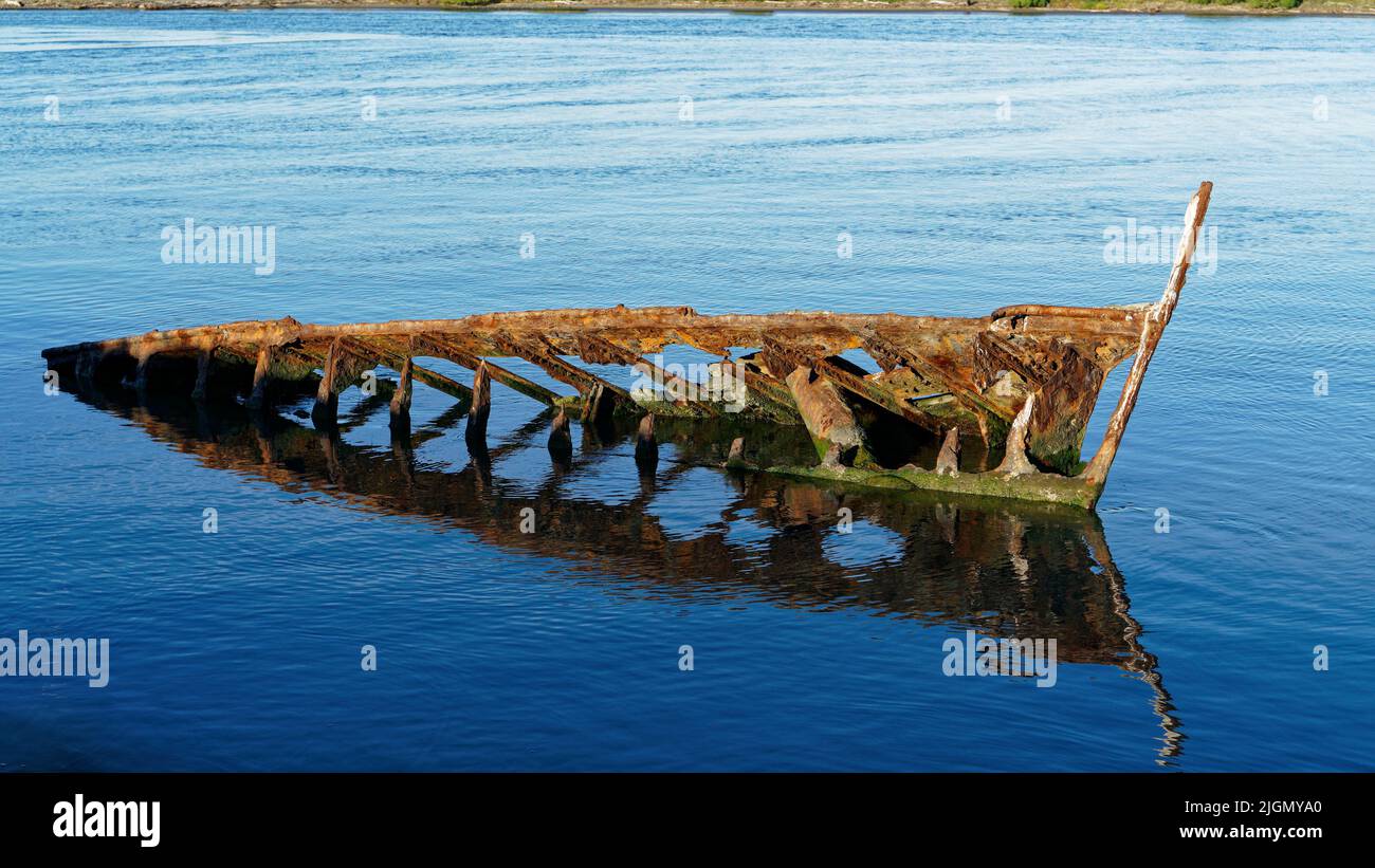 The wreck of the T.S.S. KENNEDY 1864 - 1929 dumped as a breakwater in the Wairau River mouth, Blenheim, south island, Aotearoa / New Zealand. Stock Photo