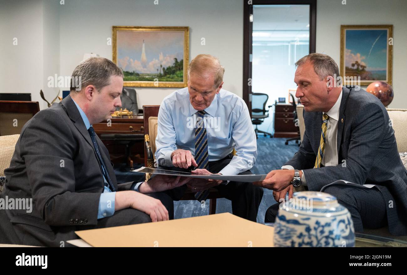 NASA Administrator Bill Nelson, center, and Associate Administrator for NASA’s Science Mission Directorate, Thomas Zurbuchen, right, speak with Webb project scientist at the Space Telescope Science Institute, Klaus Pontoppidan, left, after being shown the first full-color images from NASA’s James Webb Space Telescope in a preview meeting, Monday, July 11, 2022, at the Mary W. Jackson NASA Headquarters building in Washington. The first images and spectroscopic data from the world’s largest and most powerful space telescope, set to be released July 11 and 12, will demonstrate Webb at its full po Stock Photo