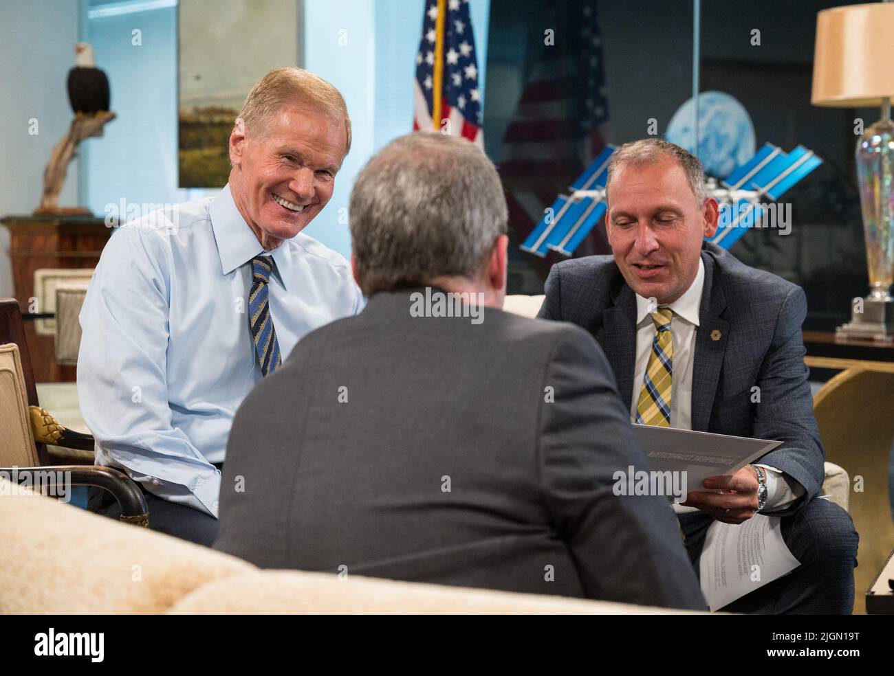 NASA Administrator Bill Nelson, left, and Associate Administrator for NASA’s Science Mission Directorate, Thomas Zurbuchen, right, speak with Webb project scientist at the Space Telescope Science Institute, Klaus Pontoppidan, center, after being shown the first full-color images from NASA’s James Webb Space Telescope in a preview meeting, Monday, July 11, 2022, at the Mary W. Jackson NASA Headquarters building in Washington. The first images and spectroscopic data from the world’s largest and most powerful space telescope, set to be released July 11 and 12, will demonstrate Webb at its full po Stock Photo