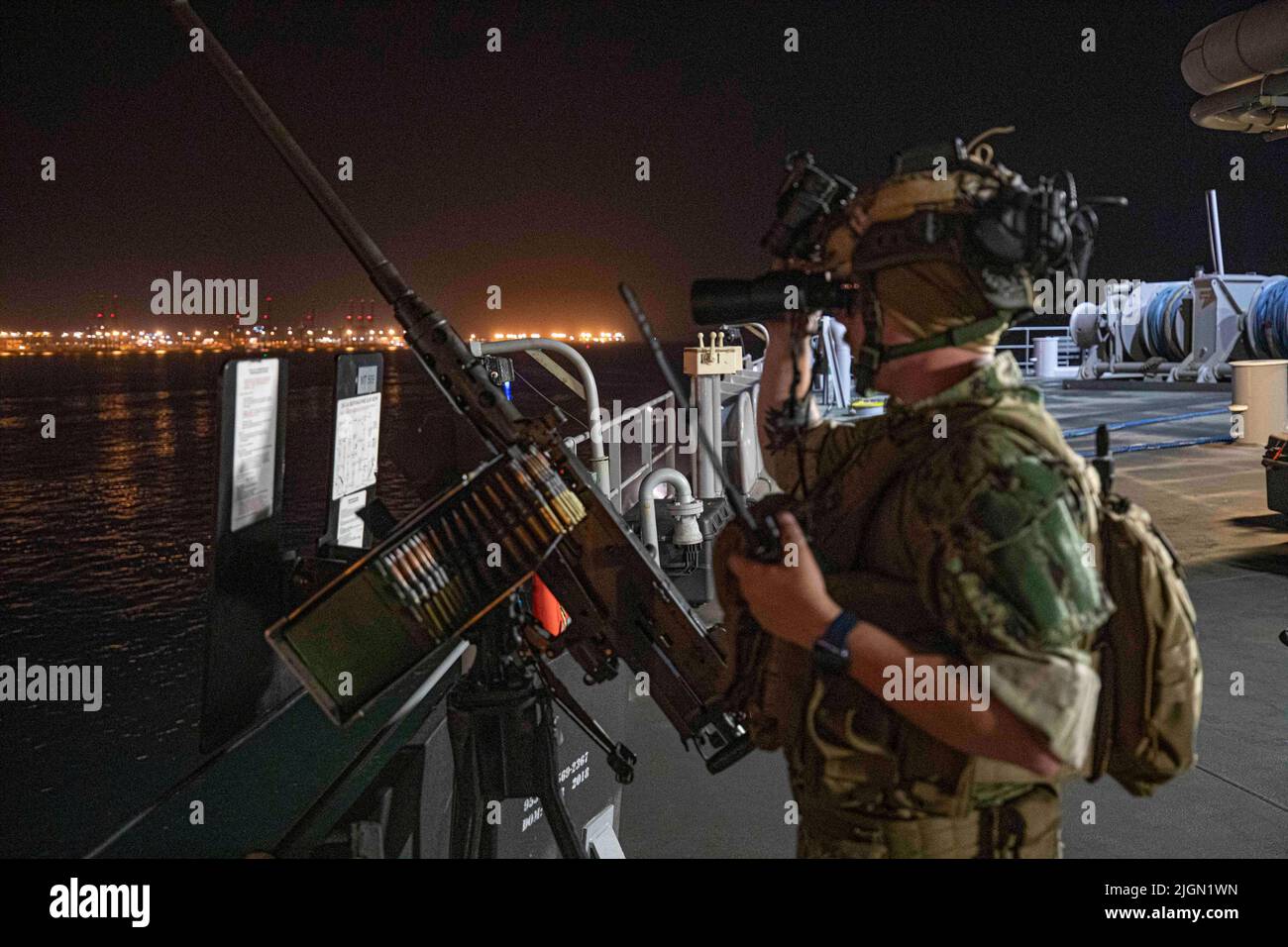 220619-N-TI693-1010    DJIBOUTI (June 19, 2022) Master-at-Arms 3rd Class Tyler Bobbitt, from Fort Worth, Texas, stands a security watch while the Lewis B. Puller-class expeditionary sea base USS Hershel 'Woody' Williams (ESB 4) departs the Port of Djibouti, June 19, 2022. Hershel “Woody” Williams is rotationally deployed to the U.S. Naval Forces Africa area of operations, employed by U.S. Sixth Fleet, to defend U.S., allied and partner interests. (U.S. Navy photo by Mass Communication Specialist 1st Class Fred Gray IV/Released) Stock Photo