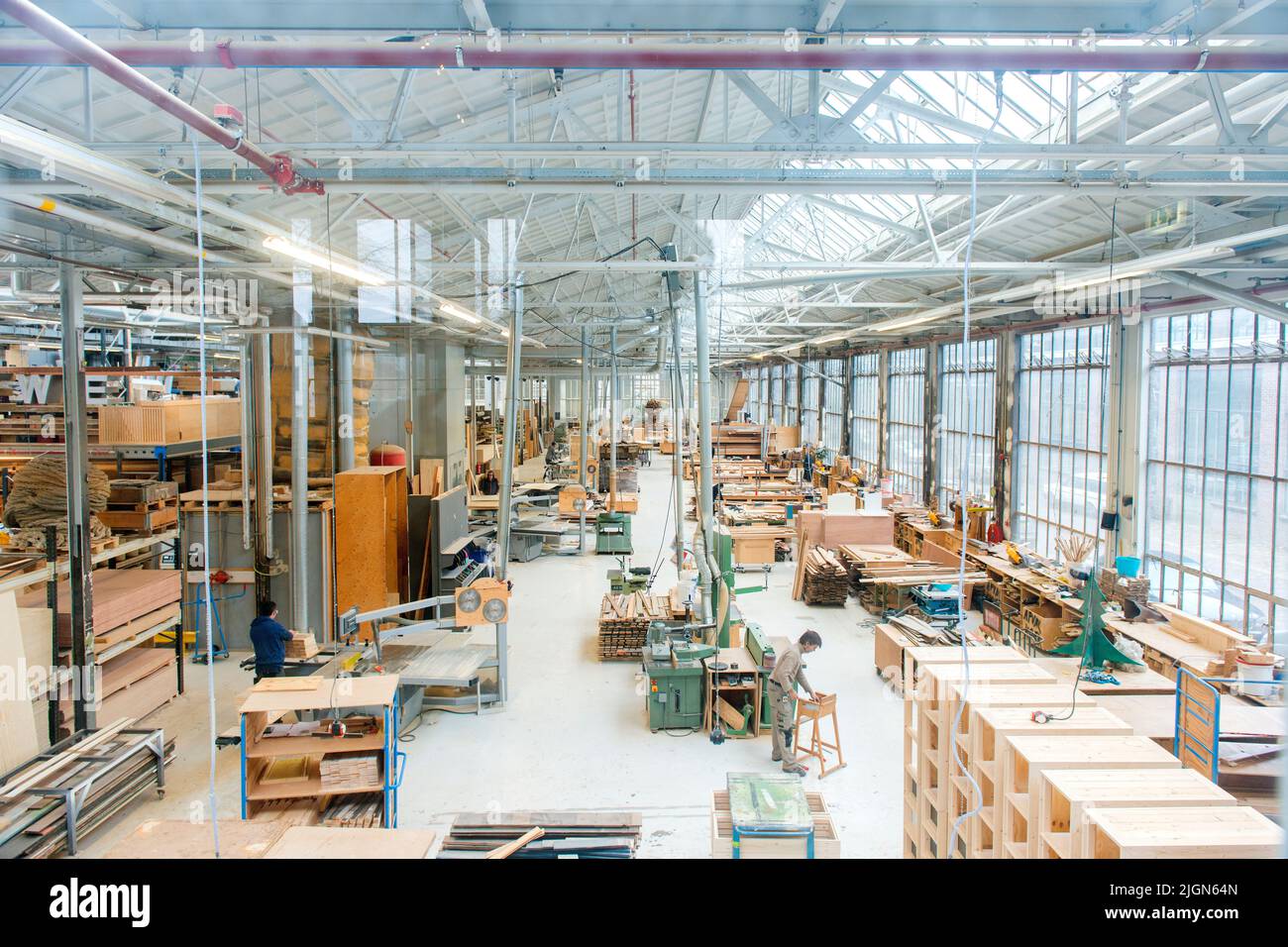 Eindhoven, Netherlands. Working wood workshop of the Piet Hein Eek interior design branche. An enterprise where skilled craftsmen and women find sustainable, high quality work and income. Stock Photo