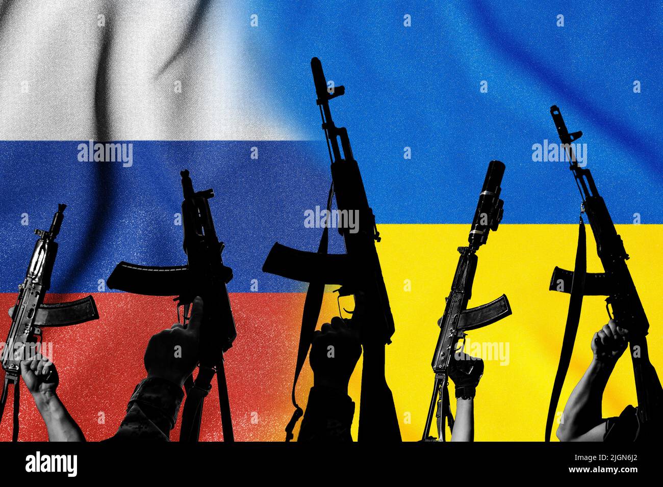Two enemy flags and combat military assault rifles AK 74 and AK 74U on their background, Russian-Ukrainian war and Russian aggression Stock Photo