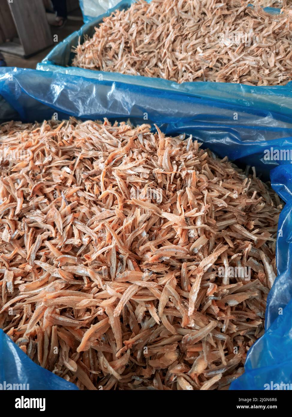 Dried anchovies in containers for sale at the market Stock Photo Alamy
