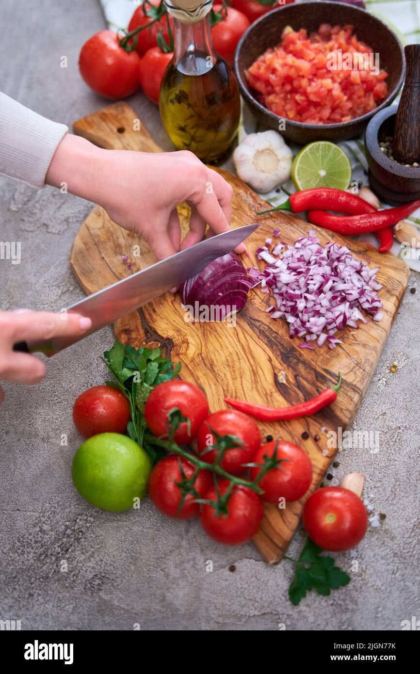 Woman chopping an onion hi-res stock photography and images - Alamy