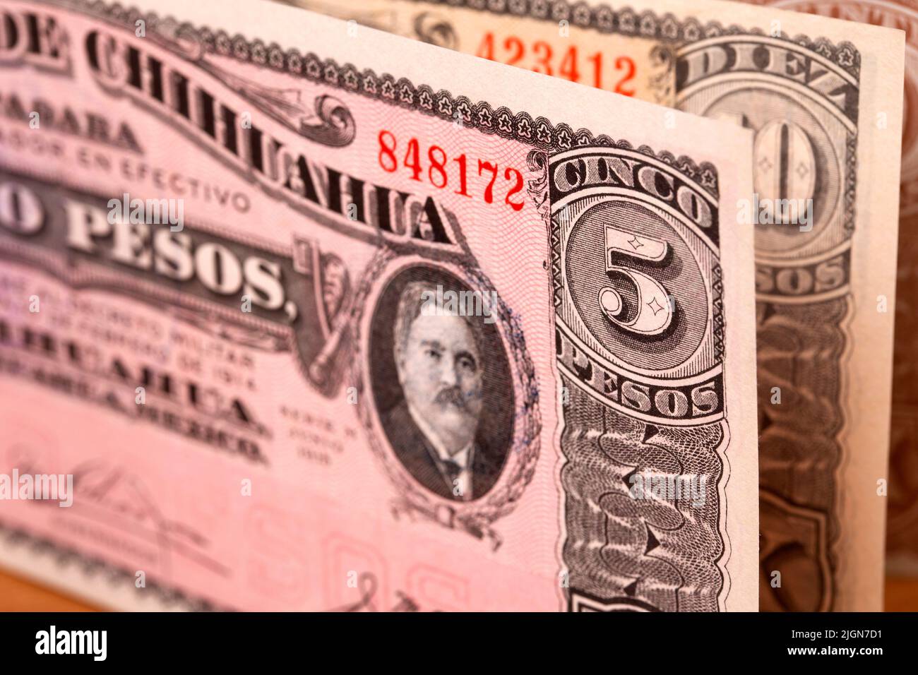 Old Mexican money - peso a business background Stock Photo