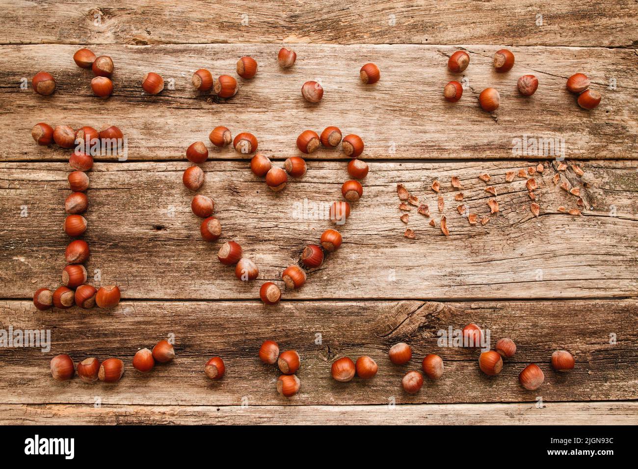 I love nuts made by hazelnuts on wood flat lay Stock Photo Alamy